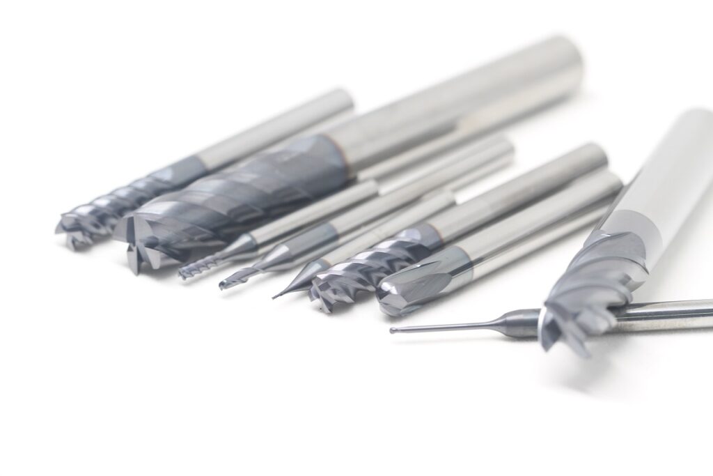 A group picture of precision solid carbide tools for machining, including end mills, drill bits, reamers, and other specialized tools. Our tools are made from the highest-quality materials and designed to provide superior accuracy and performance